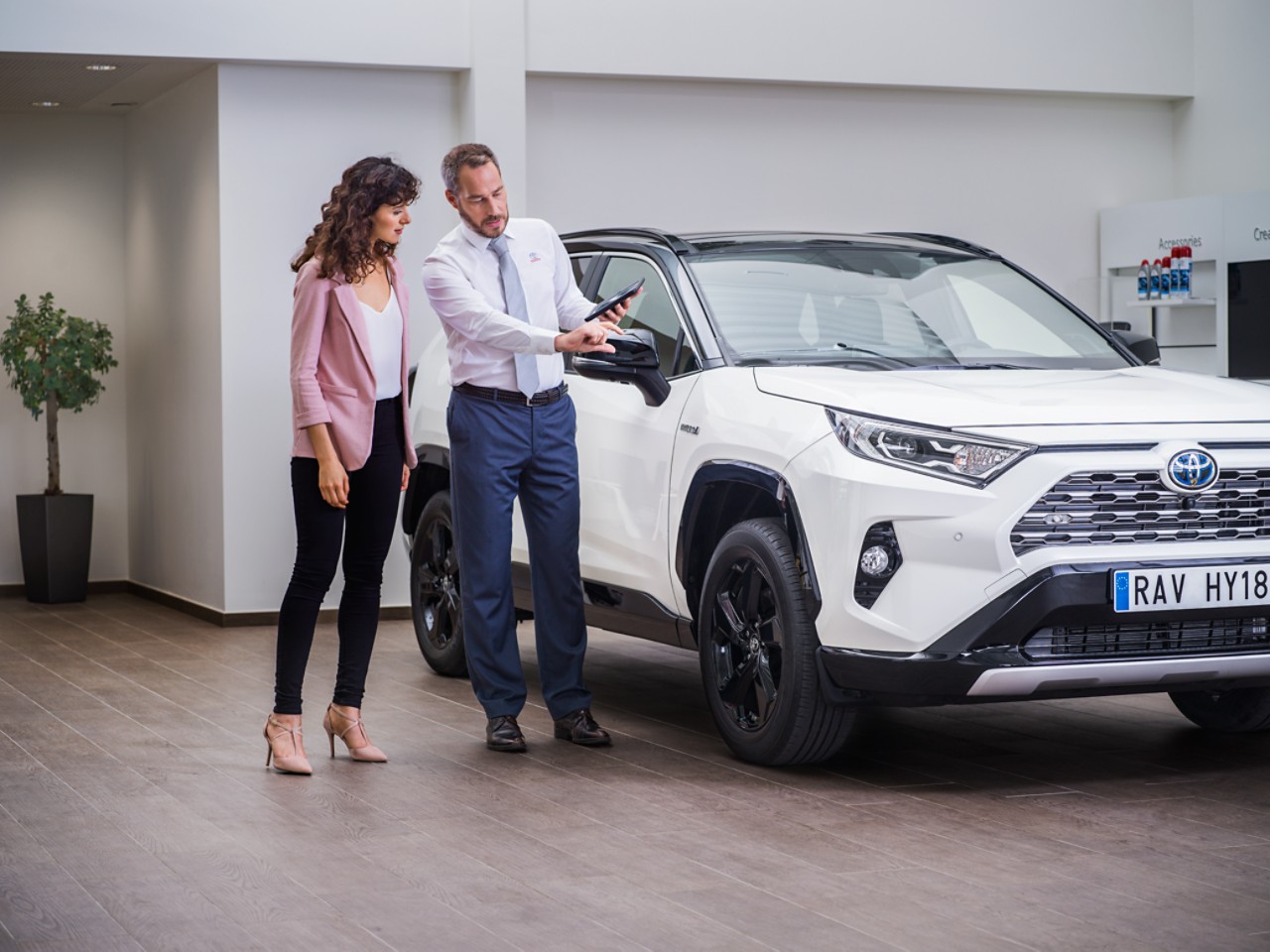 Consultant speaking to buyer about Toyota RAV4