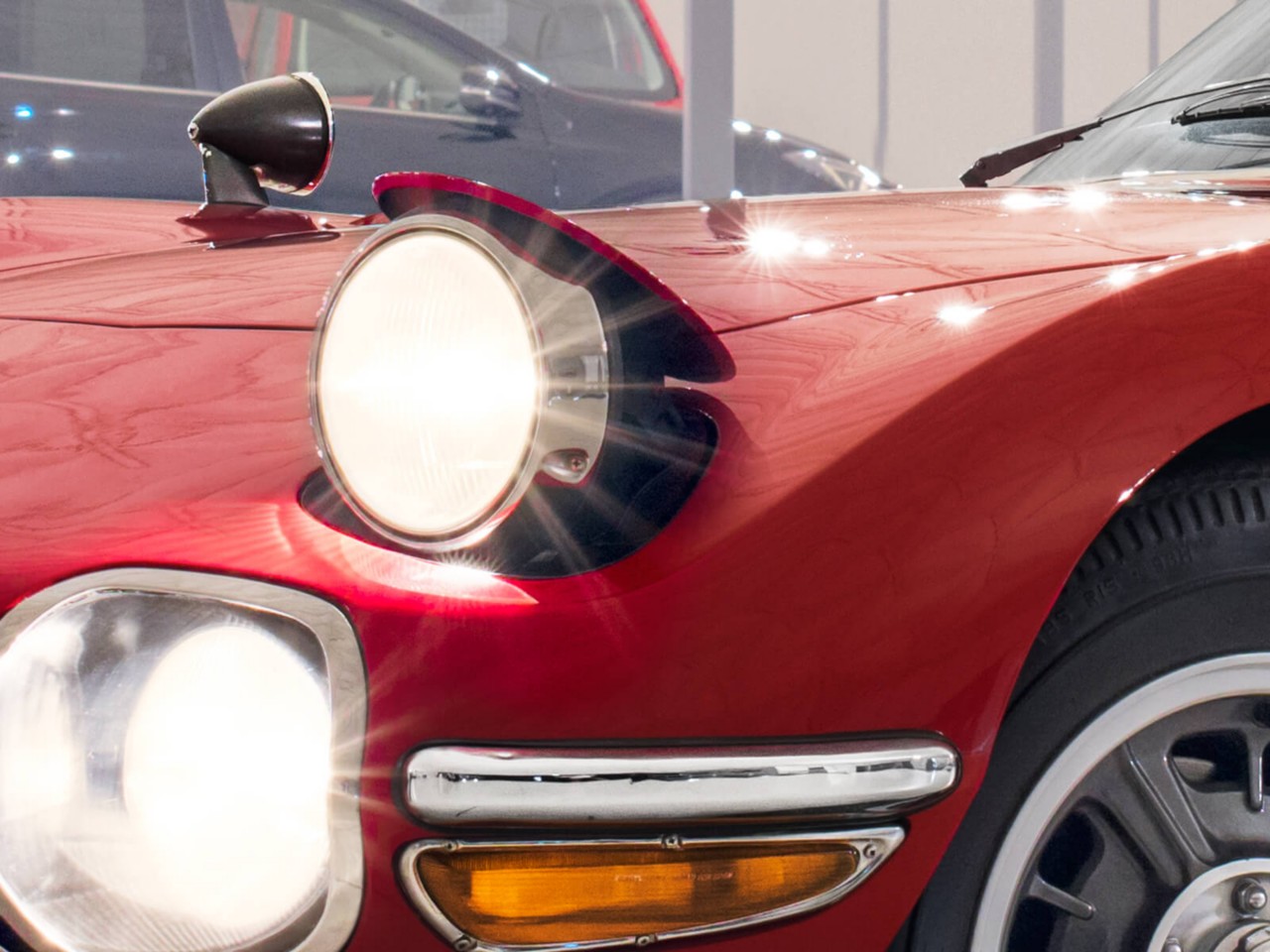 Toyota 2000GT car in red headlights
