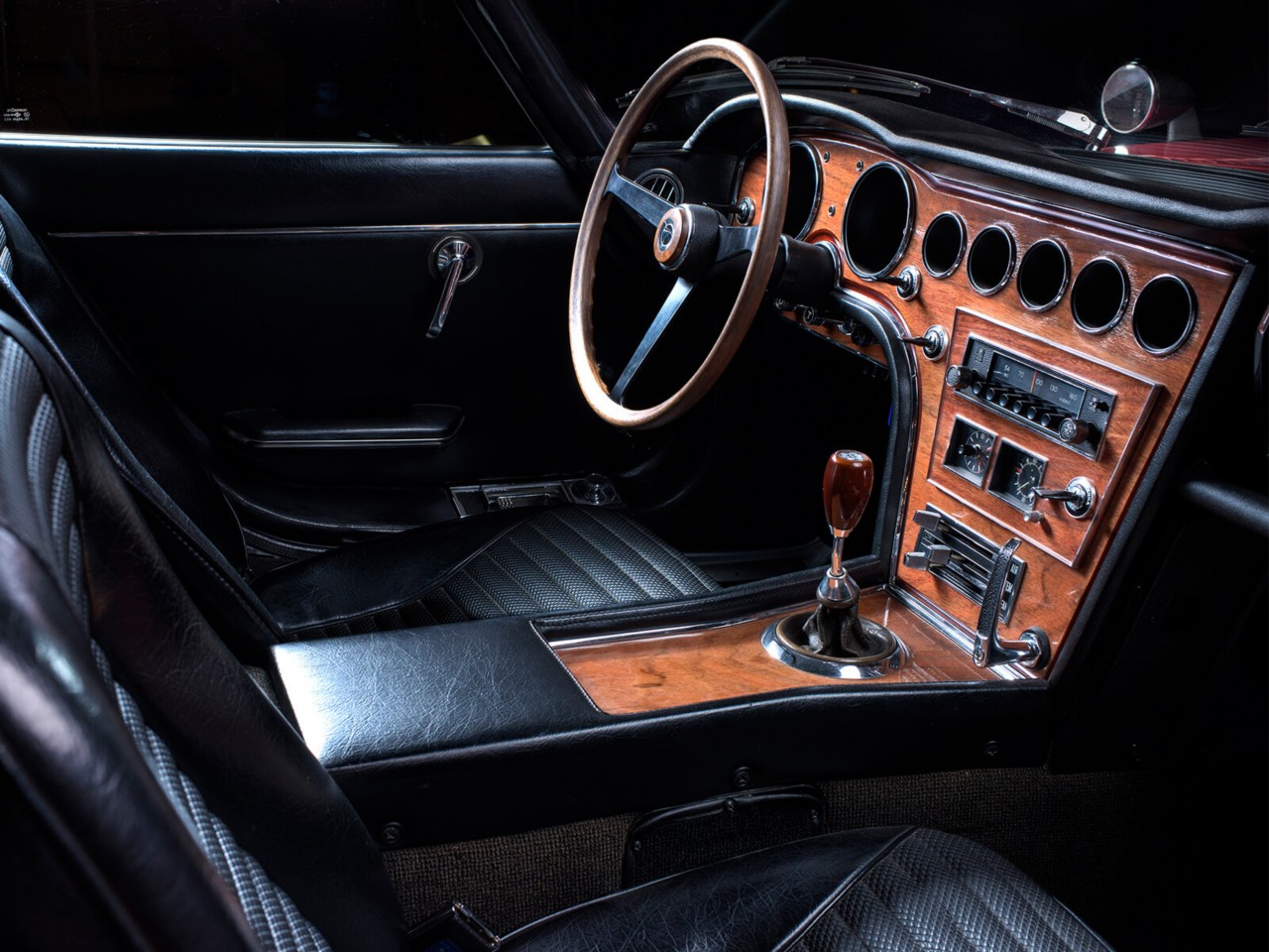 Toyota 2000GT car in red interior close up