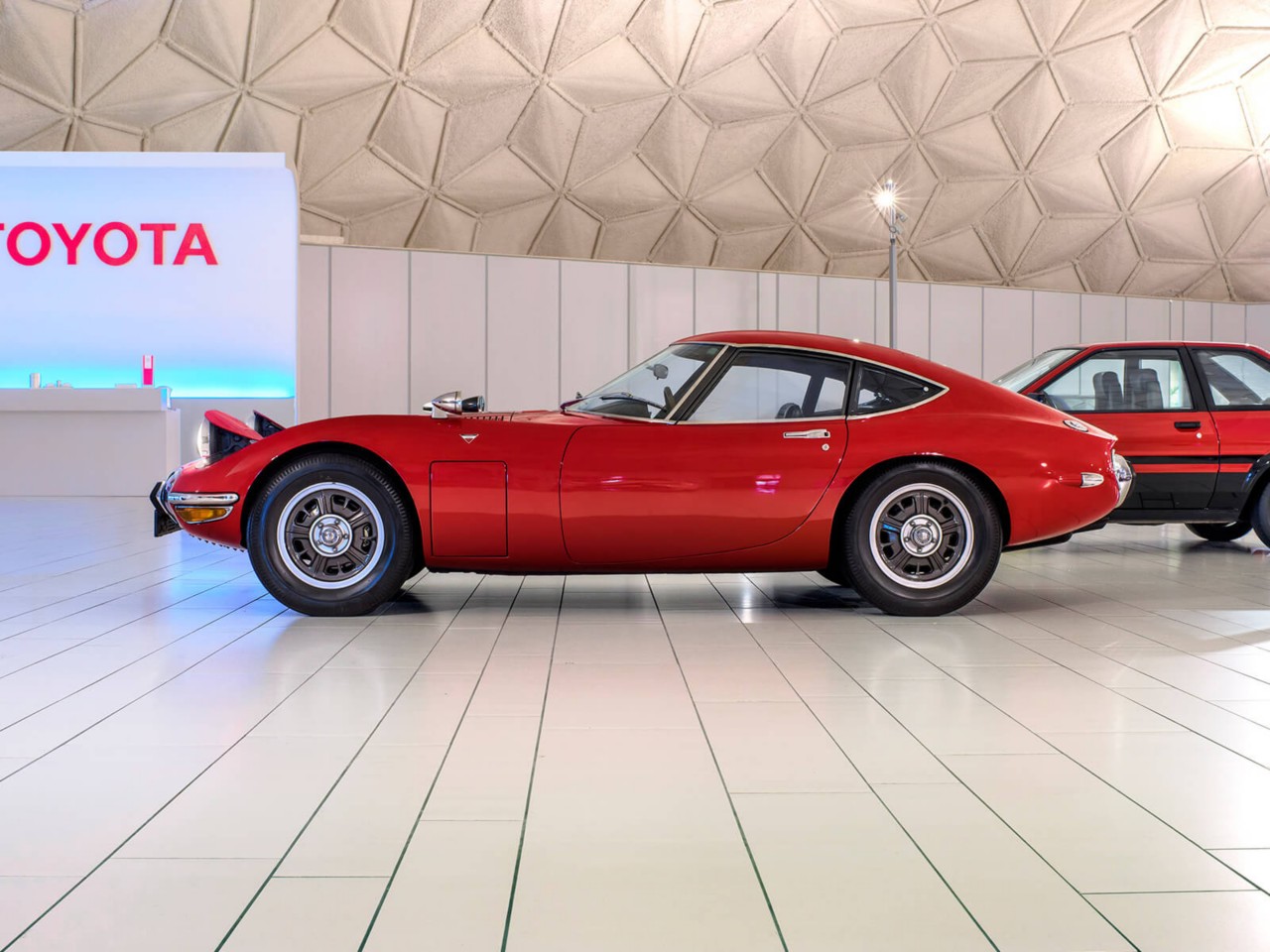 Toyota 2000GT car in red side angle