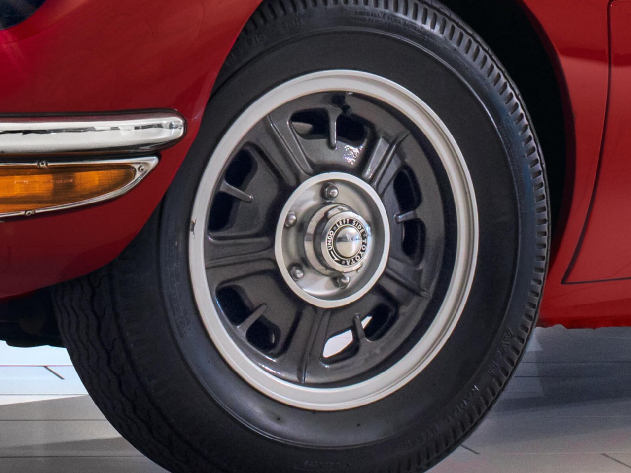 Toyota 2000GT car in red wheels close up