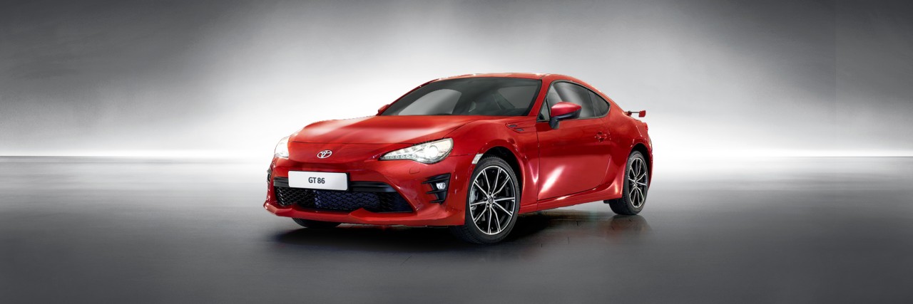 Toyota GT86 in red next to other cars