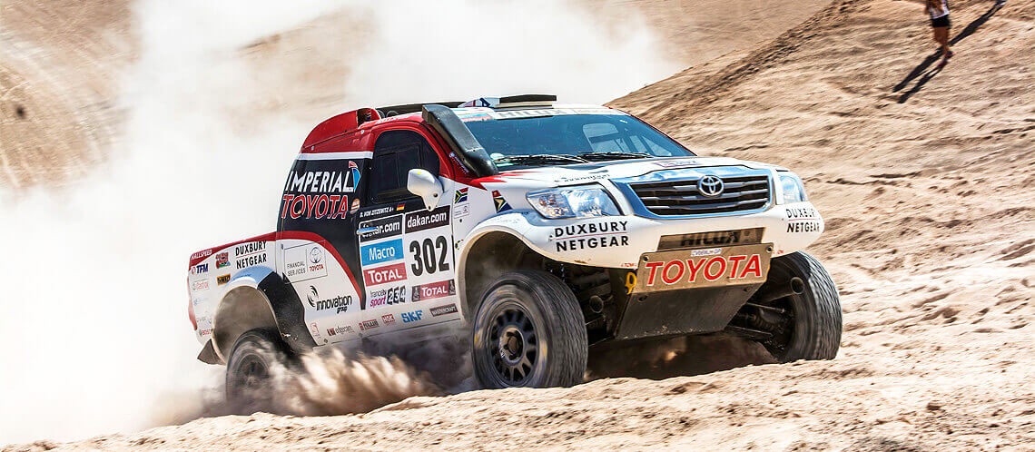 Toyota Hilux driving on dirt