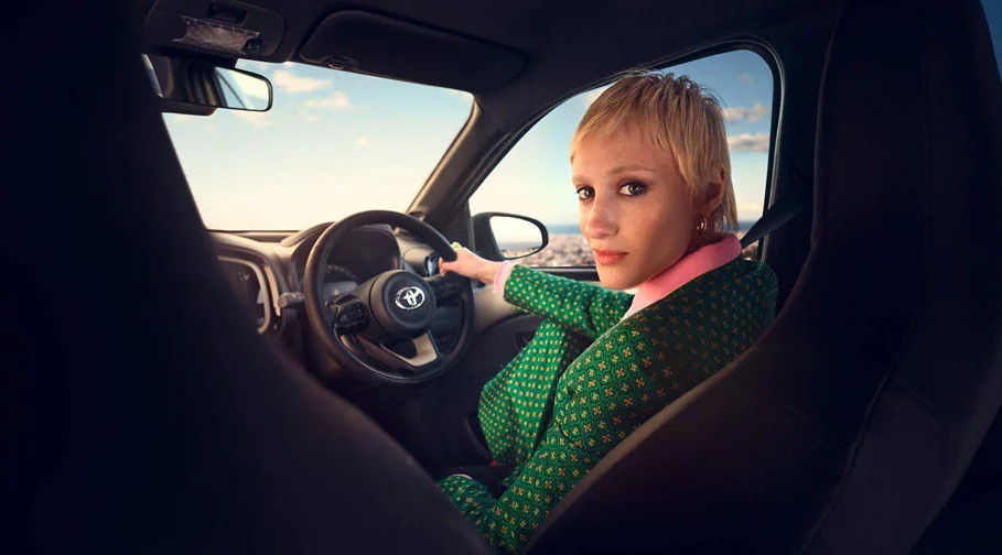 Female on the driver seat of a Toyota Aygo X