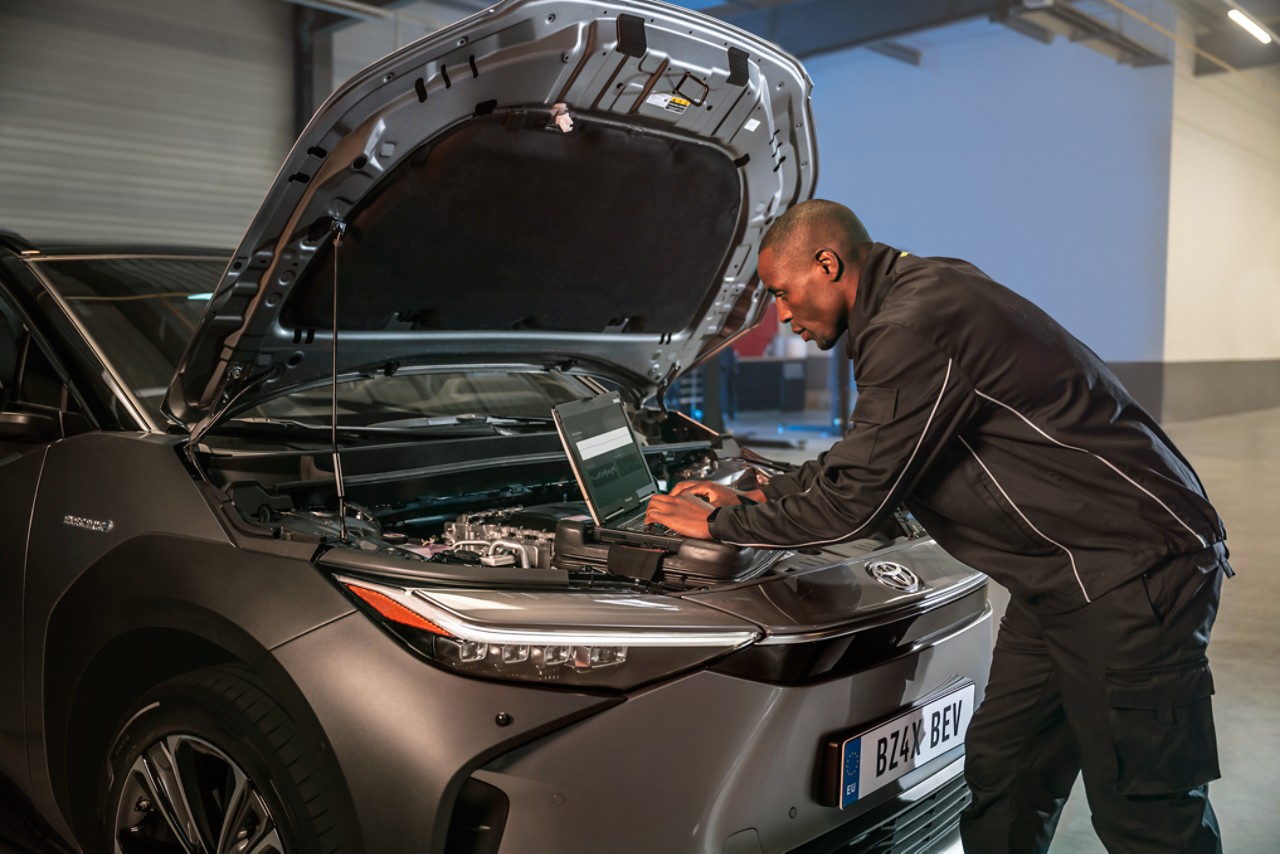 a Toyota engineer fixing a car