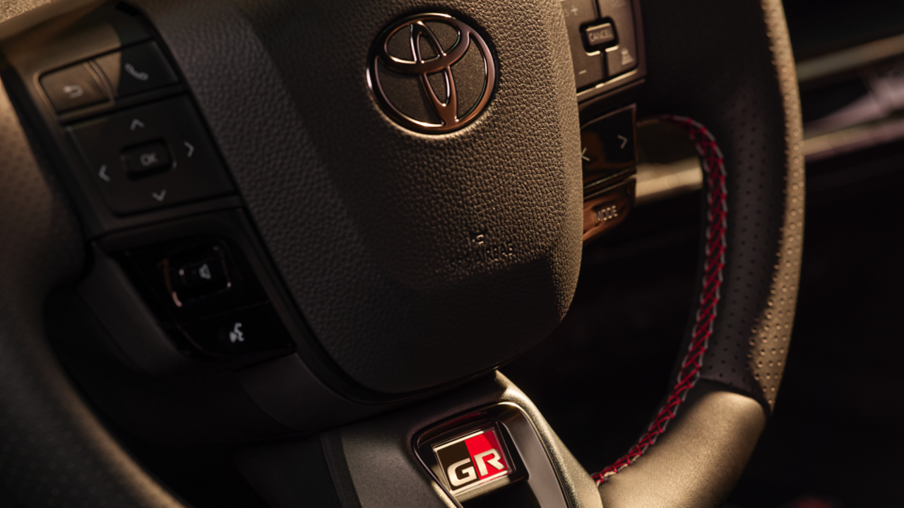 close up of the All-New Toyota C-HR steering wheel with GR Sport logo