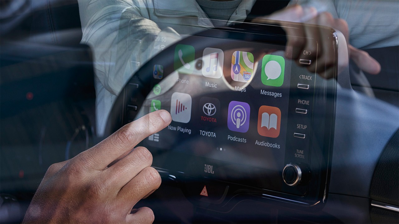 Toyota Yaris man using touchscreen on multimedia