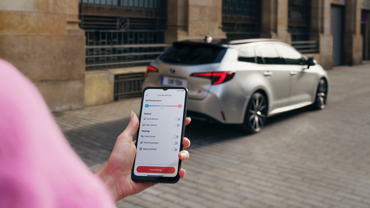person looking at MyToyota app on phone