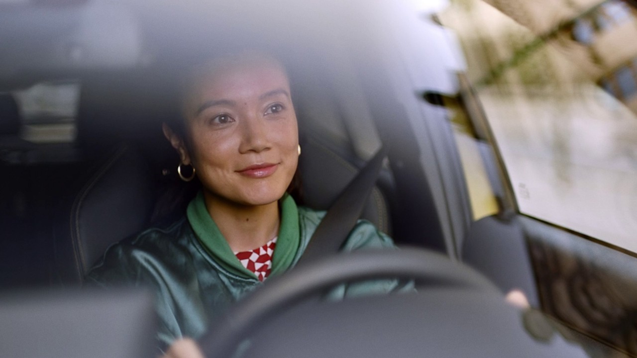 Woman driving Toyota vehicle