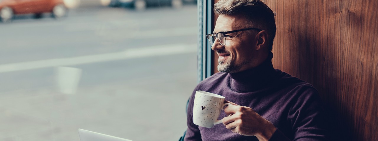 man relaxing with a coffee